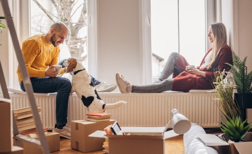 Couple with pet dog in new home