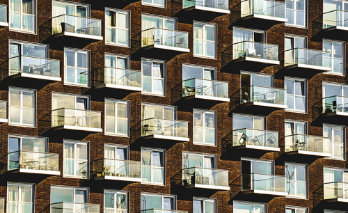 Windows and balconies on a modern apartment block.