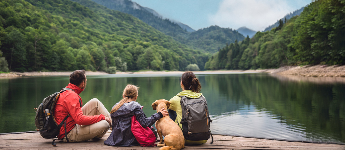 Family with a dog on pier