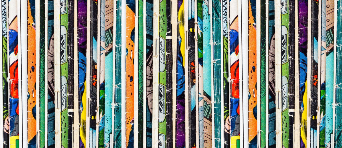 Colourful spines of comic books in a row