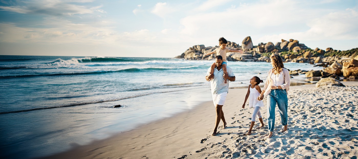 Family walking by the beach