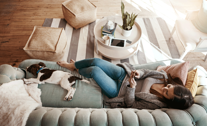 Lady and dog on sofa